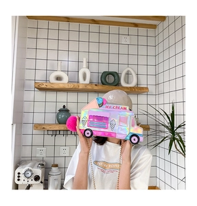 Detail of laser holographic ice cream truck crossbody bag with metal chain and fur pom