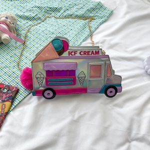 Detail of laser holographic ice cream truck crossbody bag with pink fur pom pom and chain