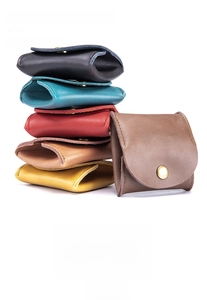 Detailed stack of multi-color cowhide leather coin purses in mini portable folding design