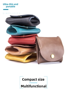 Detail view of retro genuine leather coin pouches in various colors with snap closure