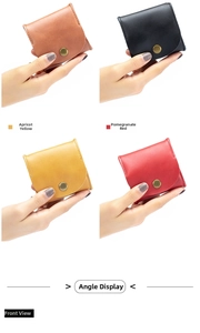 Macro shot of compact leather coin purses in four colors with vintage metal snap buttons