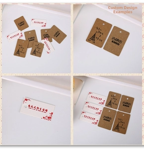 Detail of vintage kraft and white gift tags with pre-punched holes and custom printing