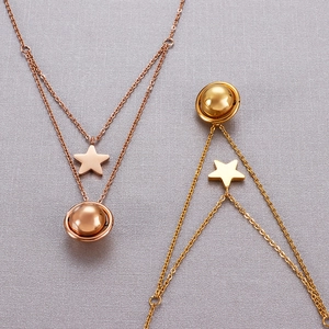 Double-layered star and planet pendant necklaces in gold and rose gold finishes
