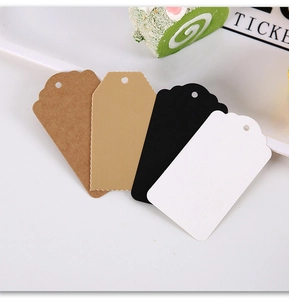 Detail of multi-color kraft paper gift tags with pre-punched holes in rectangular shapes