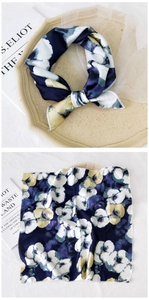 Detailed view of square silk scarf with navy ink print showing tied and flat styles