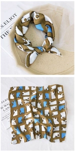 Detailed retro geometric pattern in coffee and blue on a soft square silk scarf