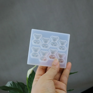 Detailed view of an 8-cavity bear-shaped silicone mold for DIY resin and soap casting
