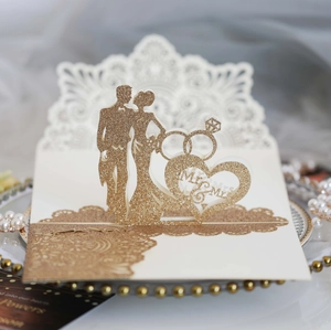 Detail of glittery gold 3D pop-up wedding card with Mr & Mrs silhouette and lace cut edges