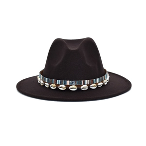 Detail of dark brown wool fedora hat featuring colorful woven band and seashell accents