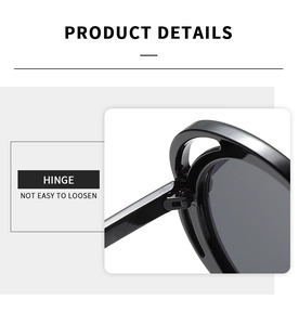 Detail view of durable metal hinge on black round sunglasses with high quality finish