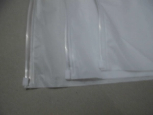 Close-up of sliding zipper lock on translucent waterproof travel storage bags