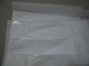Close-up of three stacked frosted translucent plastic zipper storage bags for travel