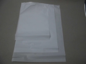 Three translucent frosted EVA storage bags in different sizes for travel organization