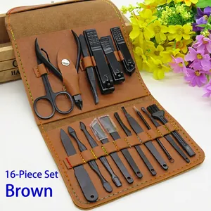 Detail of 16-piece black stainless steel manicure set in a brown leather travel case