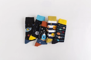 Detailed flat lay of five pairs of cotton socks with space planets and rocket patterns