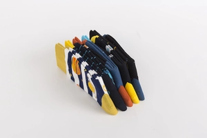 Close-up of neatly folded colorful cotton socks with space patterns and stripes