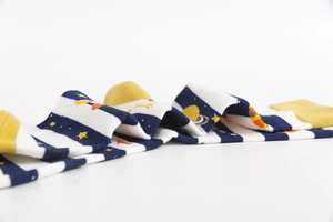 Detail view of cotton crew socks featuring space patterns with planet and star motifs