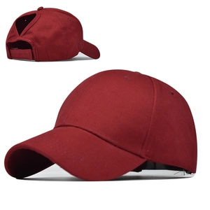 Detail of burgundy ponytail baseball cap with back opening and velcro strap adjustment