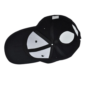 Detail of internal cotton stitching and high ponytail opening on a black baseball cap