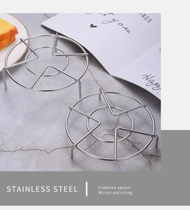 Close-up of dual round 304 stainless steel steam racks with a mirror polished finish