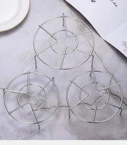 Close-up of three circular 304 stainless steel steaming racks with sturdy tripod legs