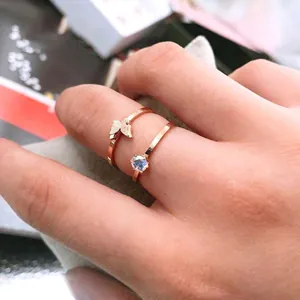 Stackable butterfly ring set in rose gold with zircon stones worn on the finger
