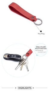 Detail of red genuine leather keychain holding multiple keys and a car remote fob