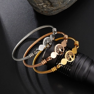 Three-piece stainless steel wire cuff bracelets with tree of life charms in gold and silver