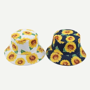 Reversible sunflower print bucket hat in navy and white for summer sun protection