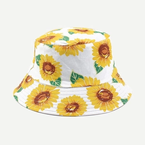 Close-up of sunflower print detail on a cotton reversible bucket hat for sun protection
