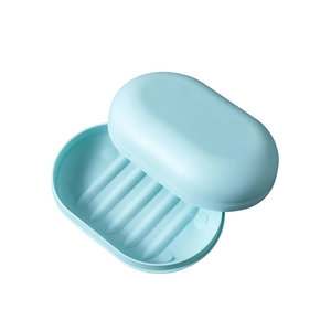 Light blue oval plastic travel soap box with lid and inner drainage tray