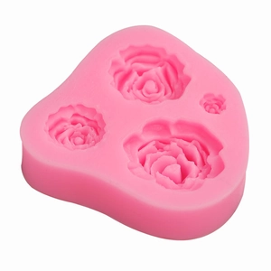 Pink silicone mold featuring four detailed rose patterns for fondant and cake DIY baking