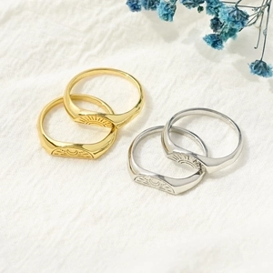 Polished 14k gold and silver rings with geometric sun and moon engravings