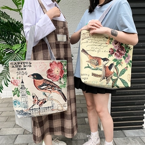 Detailed close-up of retro jacquard tote bags with vintage floral and bird patterns