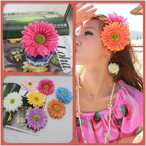 Detail of colorful fabric rose hair combs for brides showing diverse vibrant floral colors