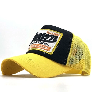 Vintage yellow and black trucker hat with Western embroidery and distressed brim