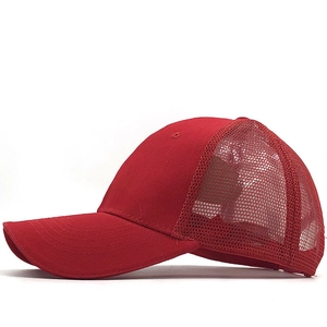 Detail view of the breathable red mesh back and curved brim on the casual trucker hat