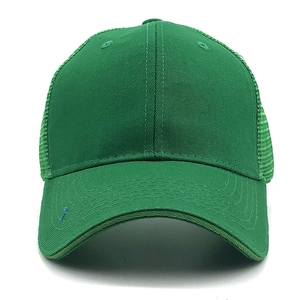 Detailed view of green trucker hat with breathable mesh back and solid curved brim