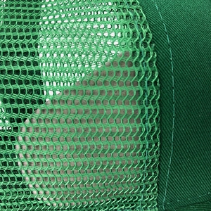 Detail of high-density breathable mesh and twill cotton stitching on green baseball cap