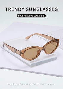 Detail view of vintage amber cat-eye sunglasses with luxury metallic temple accents