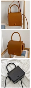 Detail of vintage square crossbody bags in brown and black with smooth leather finish