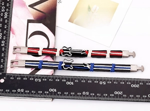 Detailed view of woven leather couple bracelets with guitar charms and size measurements