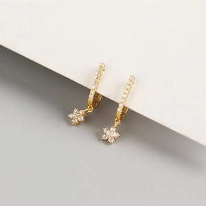 Detail of S925 sterling silver U-shaped hoop earring with sparkling zircon flower pendant