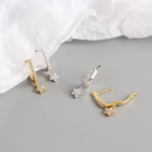 Detailed close-up of S925 sterling silver flower earrings with micro-set zircon stones