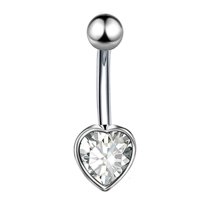 Macro shot of silver stainless steel belly button ring with heart-shaped clear crystal