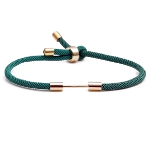 Adjustable dark green Milan rope bracelet with golden sliding metal buckle and accents
