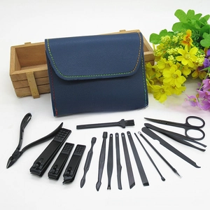 Close-up of 15pcs black matte manicure set with stainless steel nail clippers and grooming tools