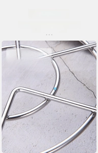 Macro shot of 304 stainless steel steamer rack with chemical material test showing high quality