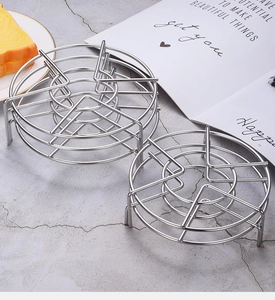 Detailed view of heavy duty 304 stainless steel round steaming rack with stable tripod feet