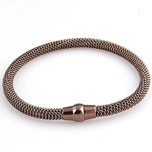 Detail of rose gold stainless steel woven mesh cable bracelet with polished magnetic clasp